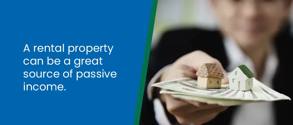 A rental property can be a great source of passive income - image of a person holding cash with tiny houses